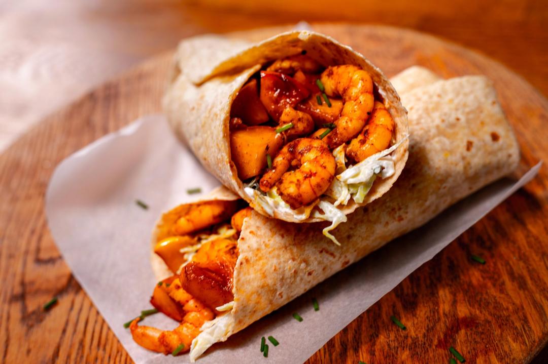 Jerk spice prawn and caramelised apple wrap